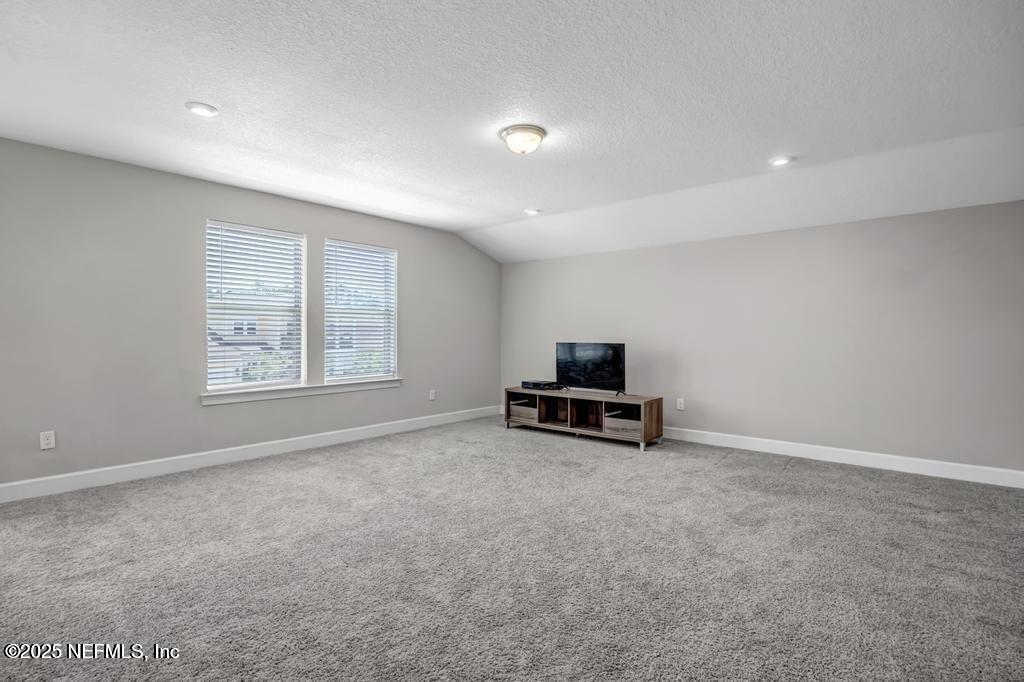 23 Catesby Lane St. Augustine, FL 32095 - Photo 14 of 31 an empty room with windows and furniture