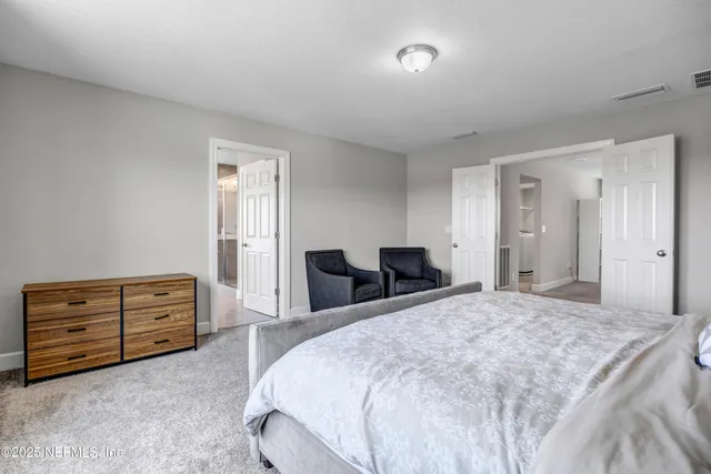 a bedroom with a bed and furniture