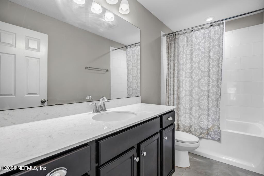 23 Catesby Lane St. Augustine, FL 32095 - Photo 23 of 31 a bathroom with a granite countertop sink toilet and shower