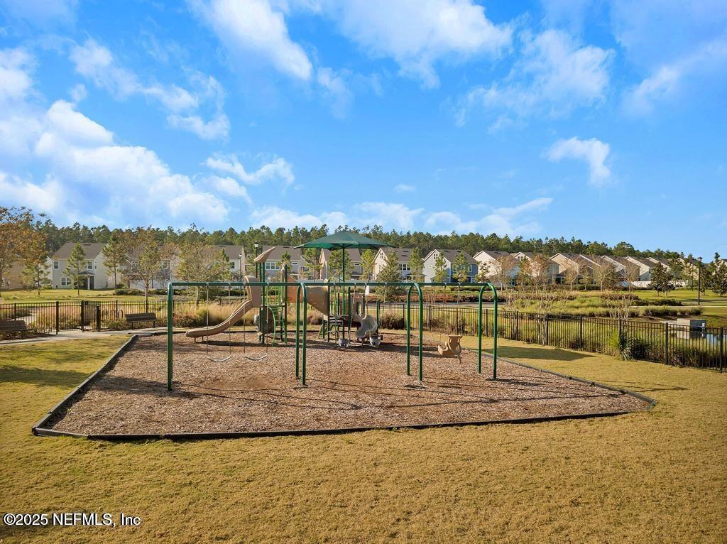 23 Catesby Lane St. Augustine, FL 32095 - Photo 29 of 31 a view of a lake with a table and chairs