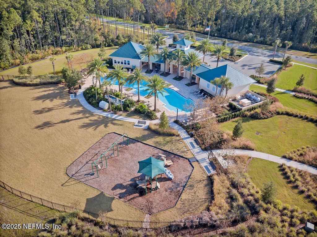 23 Catesby Lane St. Augustine, FL 32095 - Photo 30 of 31 a view of swimming pool with a dining table and chairs