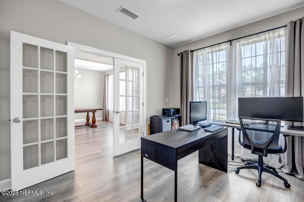 23 Catesby Lane St. Augustine, FL 32095 - Photo 3 of 31 a view of a workspace with furniture and a window