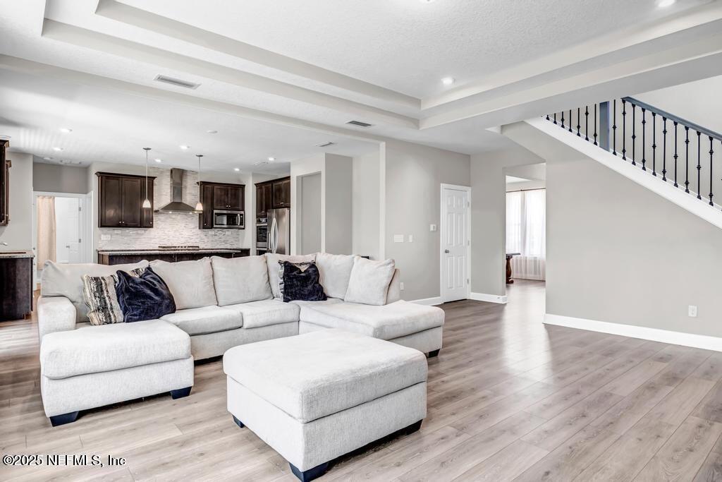 23 Catesby Lane St. Augustine, FL 32095 - Photo 4 of 31 a living room with furniture and a wooden floor