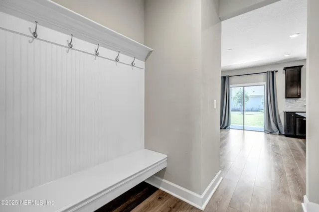 a view of entryway with wooden floor