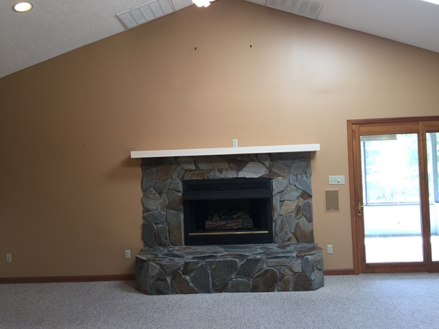 4802 Sandy Point Road Lizella, GA 31052 - Photo 22 of 45 a living room with a fireplace