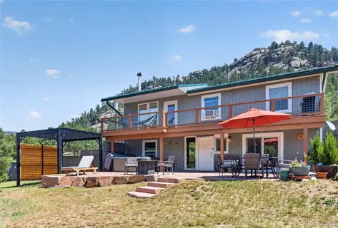 a front view of a building with sitting area