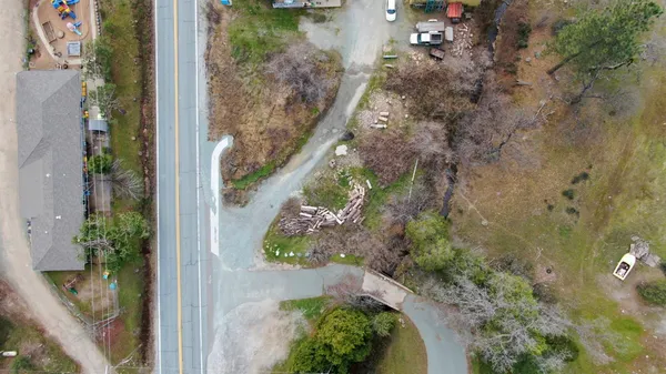 an aerial view of a house with a yard and a lake view