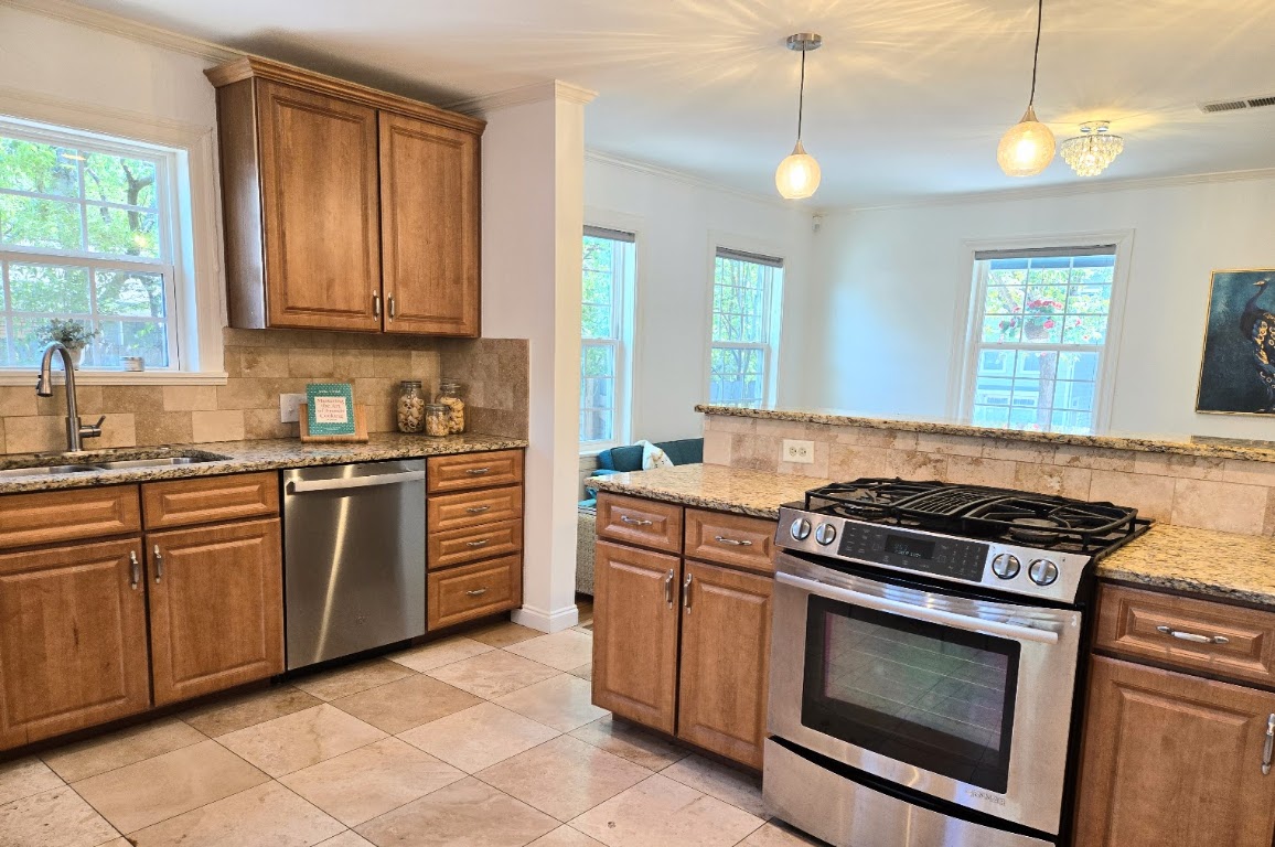 2108 Glendale Place Austin, TX 78704 - Photo 22 of 36 a kitchen with cabinets appliances and a window