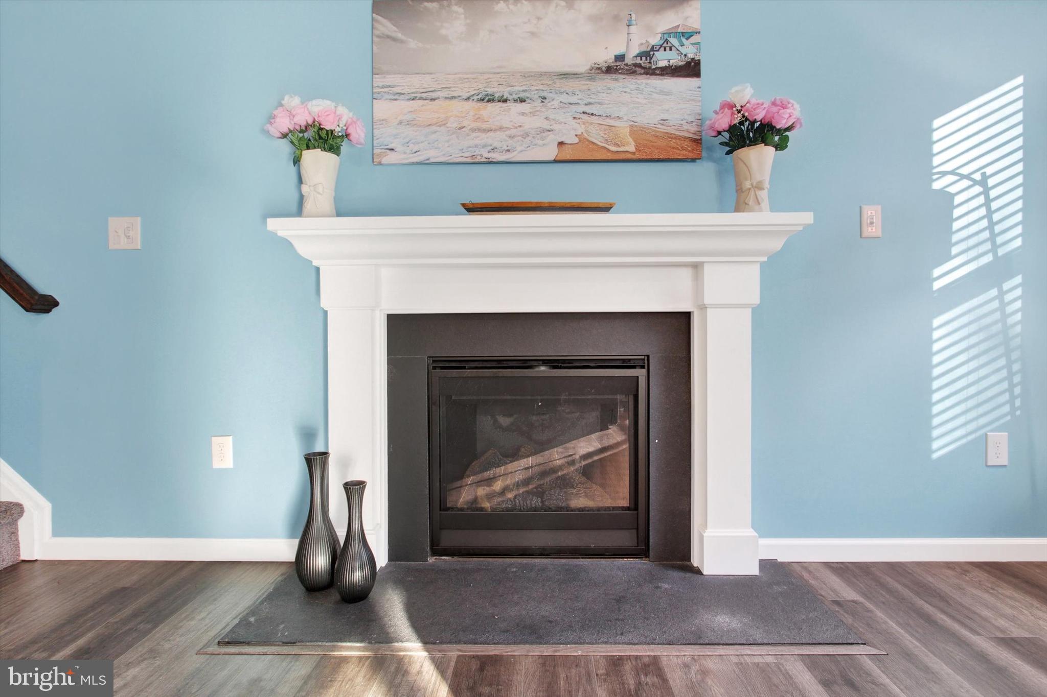 155 Sunbury Way Red Lion, PA 17356 - Photo 15 of 36 a living room with a fireplace and flowers