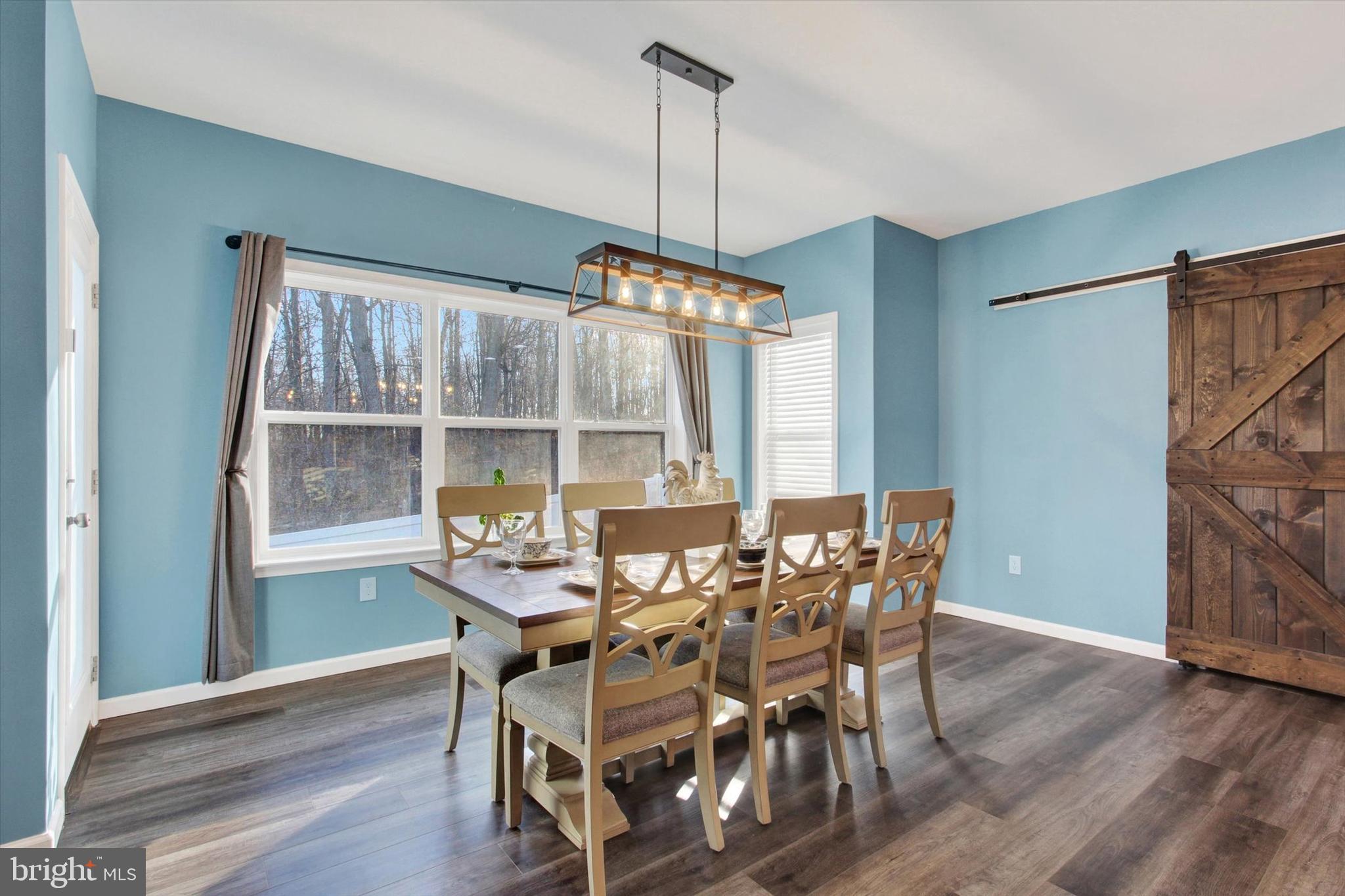 155 Sunbury Way Red Lion, PA 17356 - Photo 4 of 36 a view of a dining room with furniture window and wooden floor