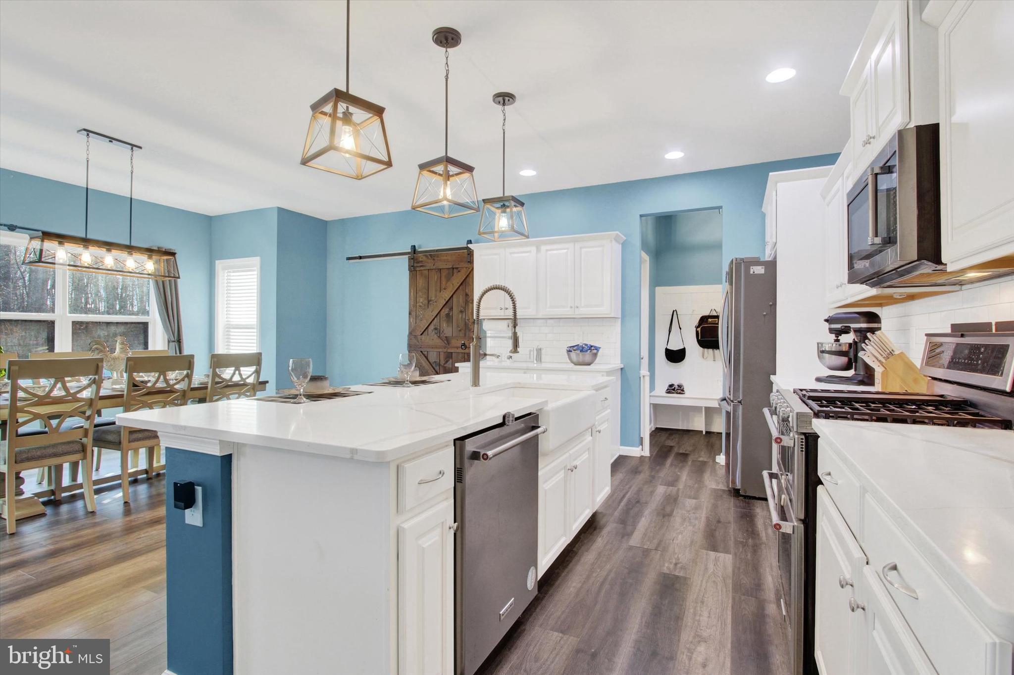 155 Sunbury Way Red Lion, PA 17356 - Photo 10 of 36 a kitchen with cabinets a stove and a chandelier