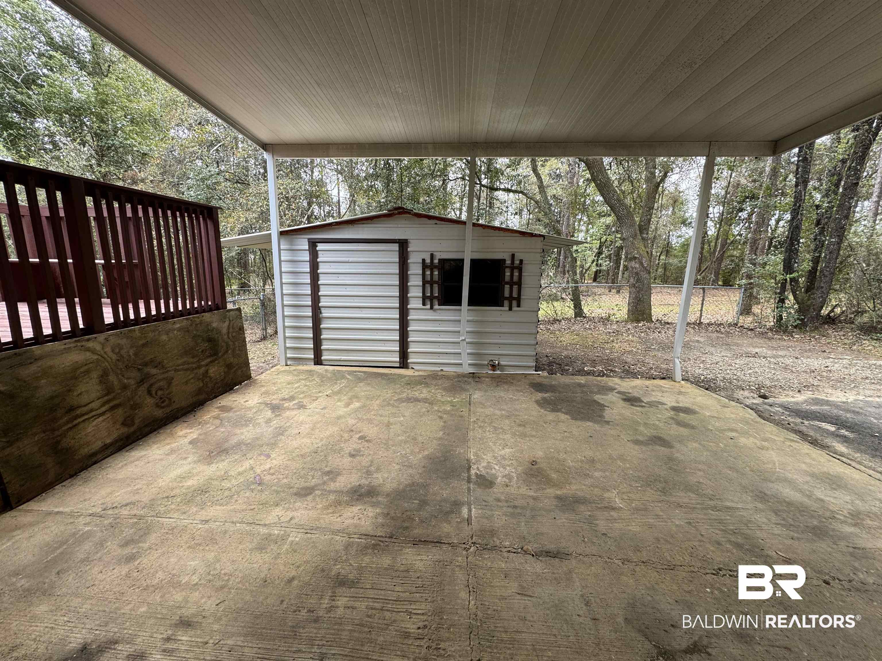 8065 Middle Ring Road Mobile, AL 36619 - Photo 21 of 21 Exterior space featuring a storage shed, an outdoor structure, and fence