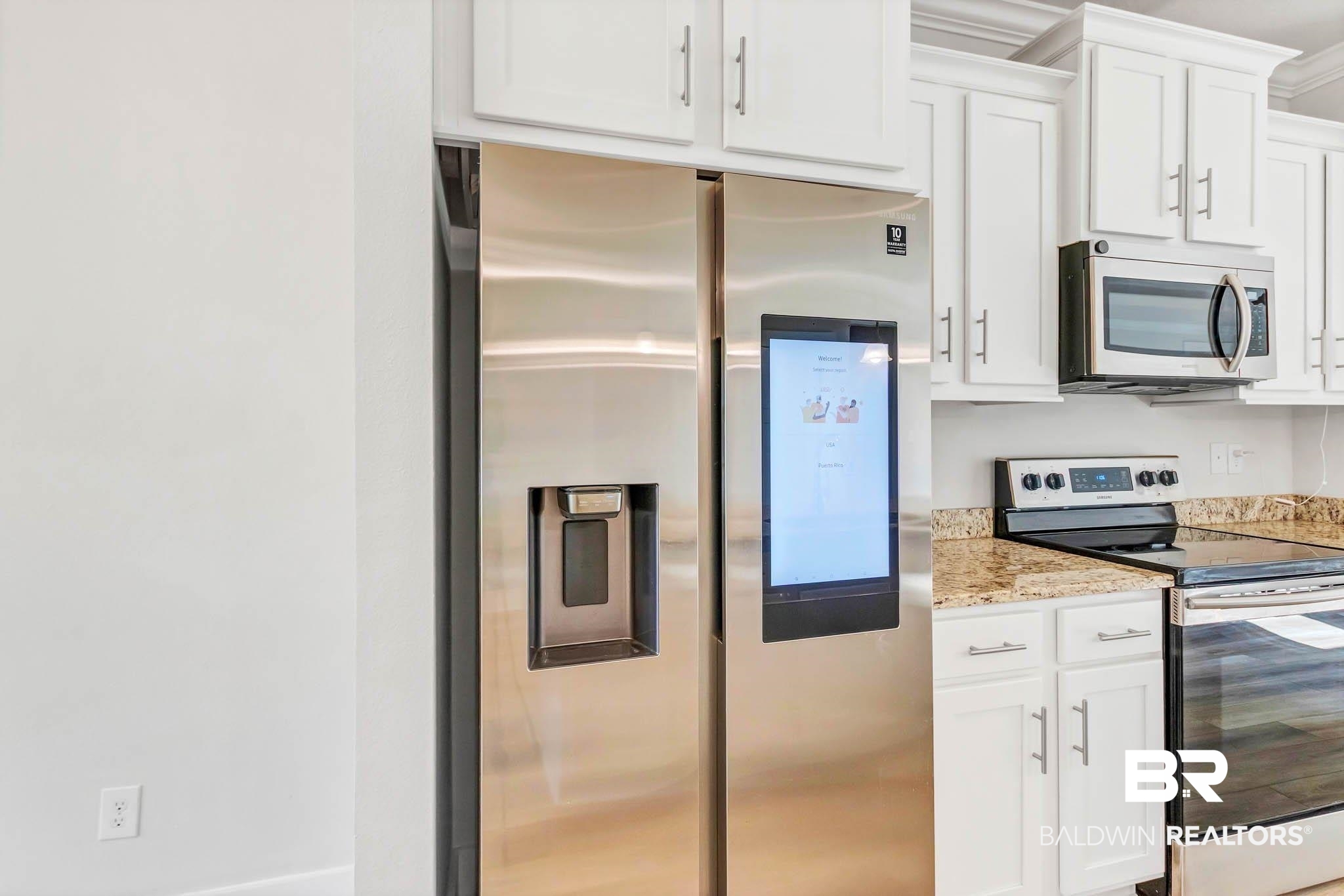 16461 Prado Loop Loxley, AL 36551 - Photo 15 of 78 Kitchen with stainless steel appliances, white cabinetry, and light stone counters