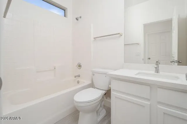 a bathroom with a sink a toilet and a bathtub
