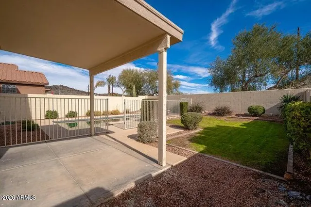 a view of a porch with furniture and garden