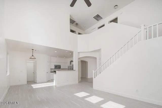 a view of a kitchen with a sink and a refrigerator