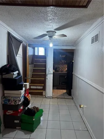 a kitchen with stainless steel appliances kitchen island granite countertop a refrigerator and a stove