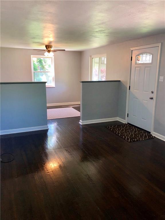 1040 5th Street Baden, PA 15005 - Photo 13 of 25 a view of a livingroom with wooden floor and a window