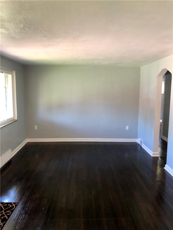 1040 5th Street Baden, PA 15005 - Photo 14 of 25 a view of an empty room and wooden floor and a window