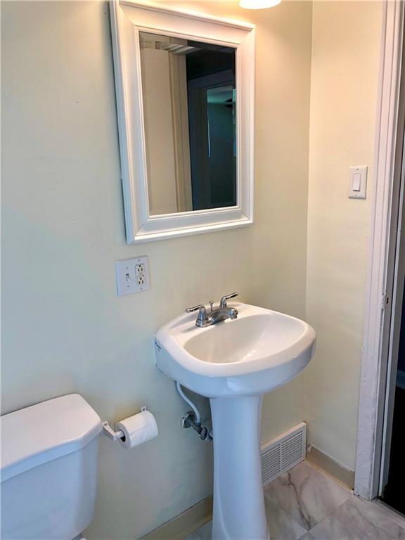 1040 5th Street Baden, PA 15005 - Photo 22 of 25 a bathroom with a sink and a toilet