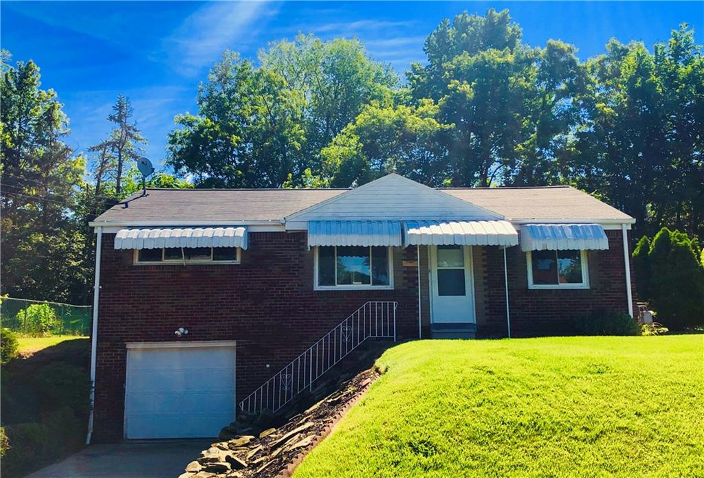 1040 5th Street Baden, PA 15005 - Photo 3 of 25 a front view of a house with a yard