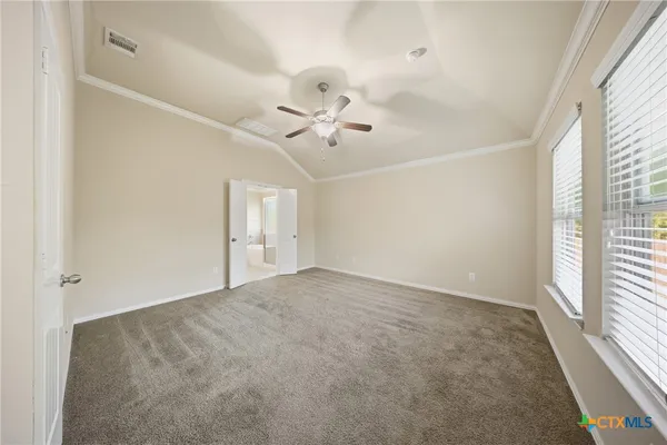 a bathroom with a bathtub shower and mirror