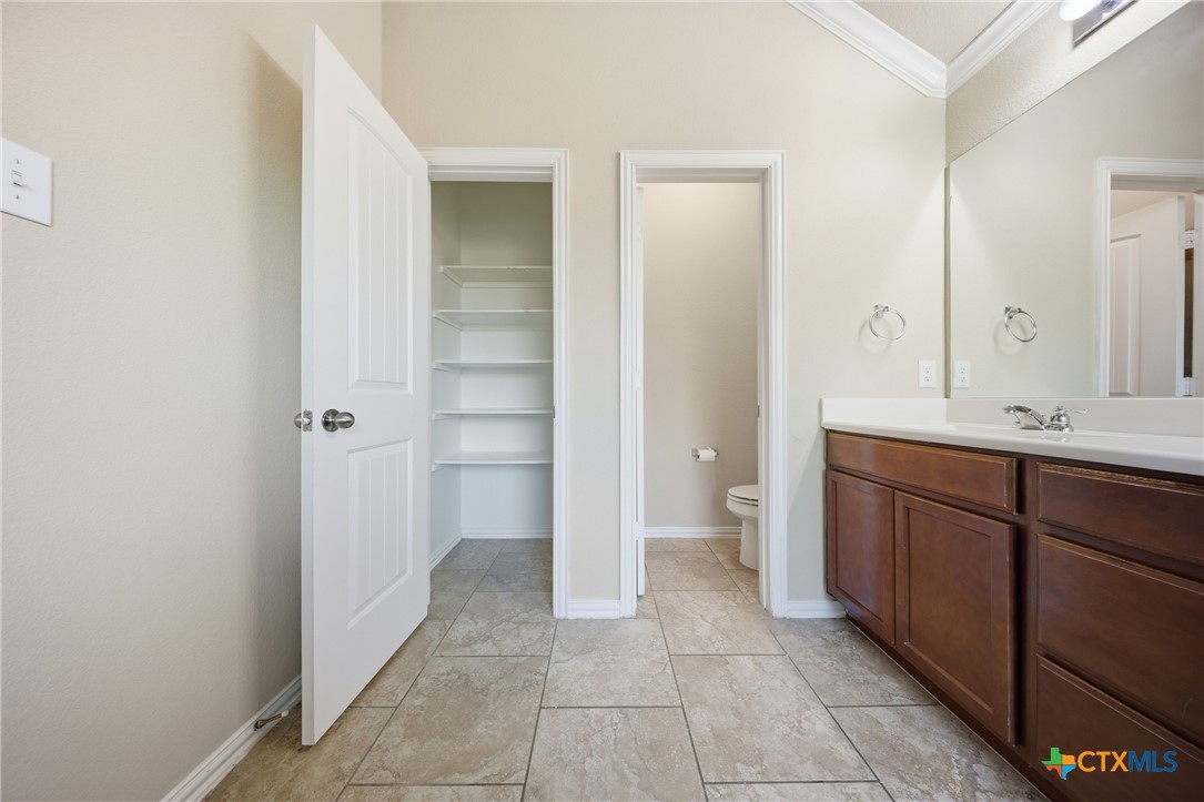 728 Olaf Drive Temple, TX 76504 - Photo 13 of 26 a bathroom with a sink and a mirror