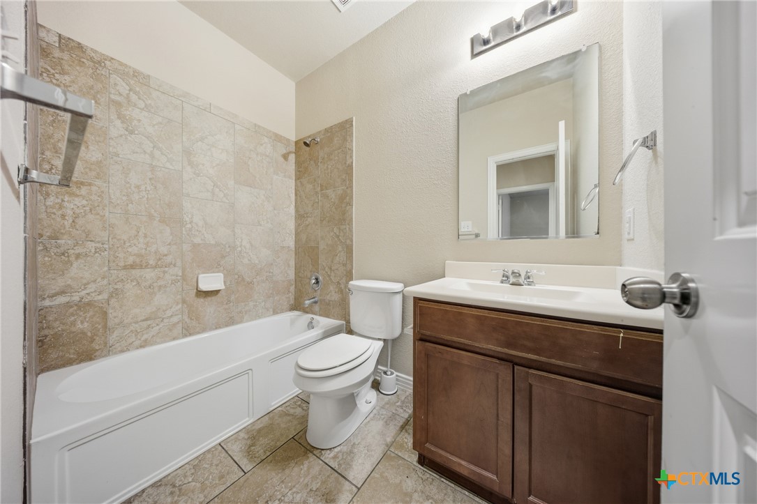 728 Olaf Drive Temple, TX 76504 - Photo 20 of 26 a bathroom with a sink toilet and shower