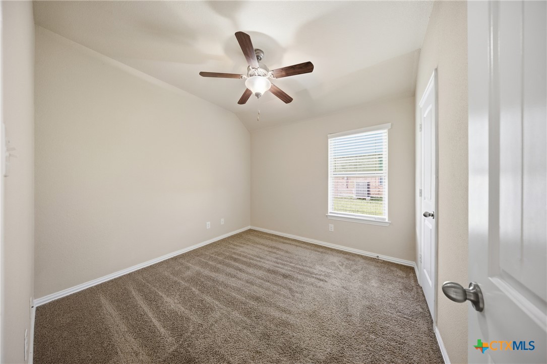 728 Olaf Drive Temple, TX 76504 - Photo 21 of 26 a view of a livingroom with a ceiling fan and window