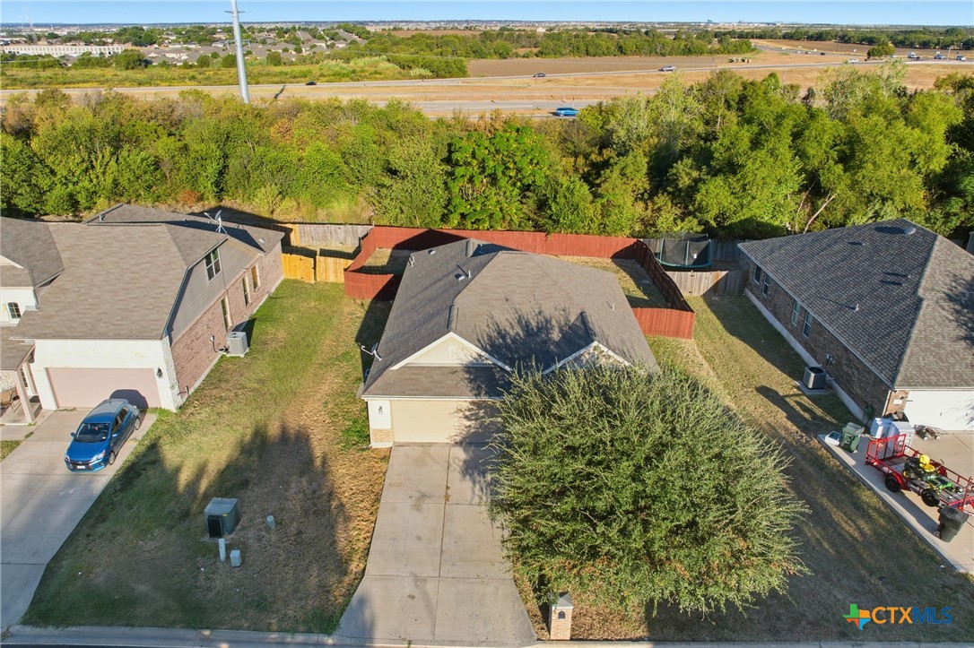 728 Olaf Drive Temple, TX 76504 - Photo 25 of 26 an aerial view of a house with a lake view