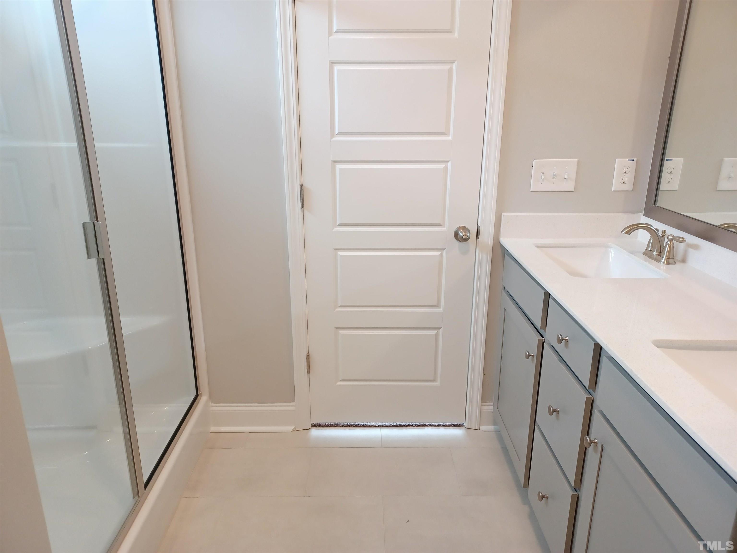 184 Howards Crossing Drive Wendell, NC 27591 - Photo 13 of 27 a bathroom with a sink and mirror