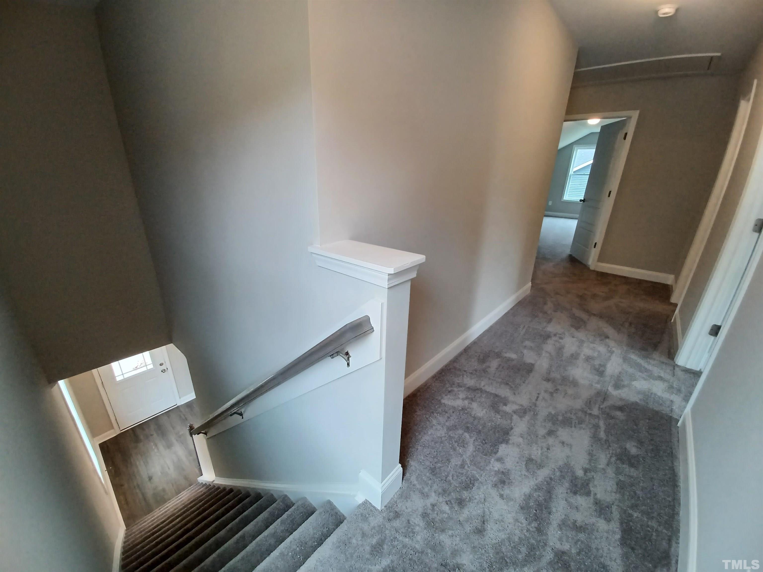 184 Howards Crossing Drive Wendell, NC 27591 - Photo 14 of 27 a view of wooden floor and stairs in a room