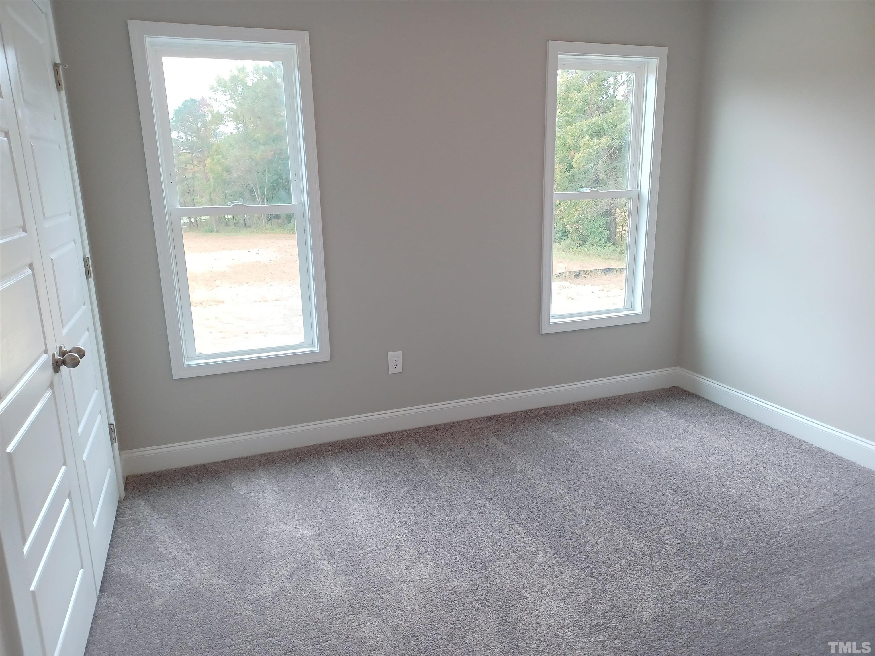 184 Howards Crossing Drive Wendell, NC 27591 - Photo 16 of 27 an empty room with a window