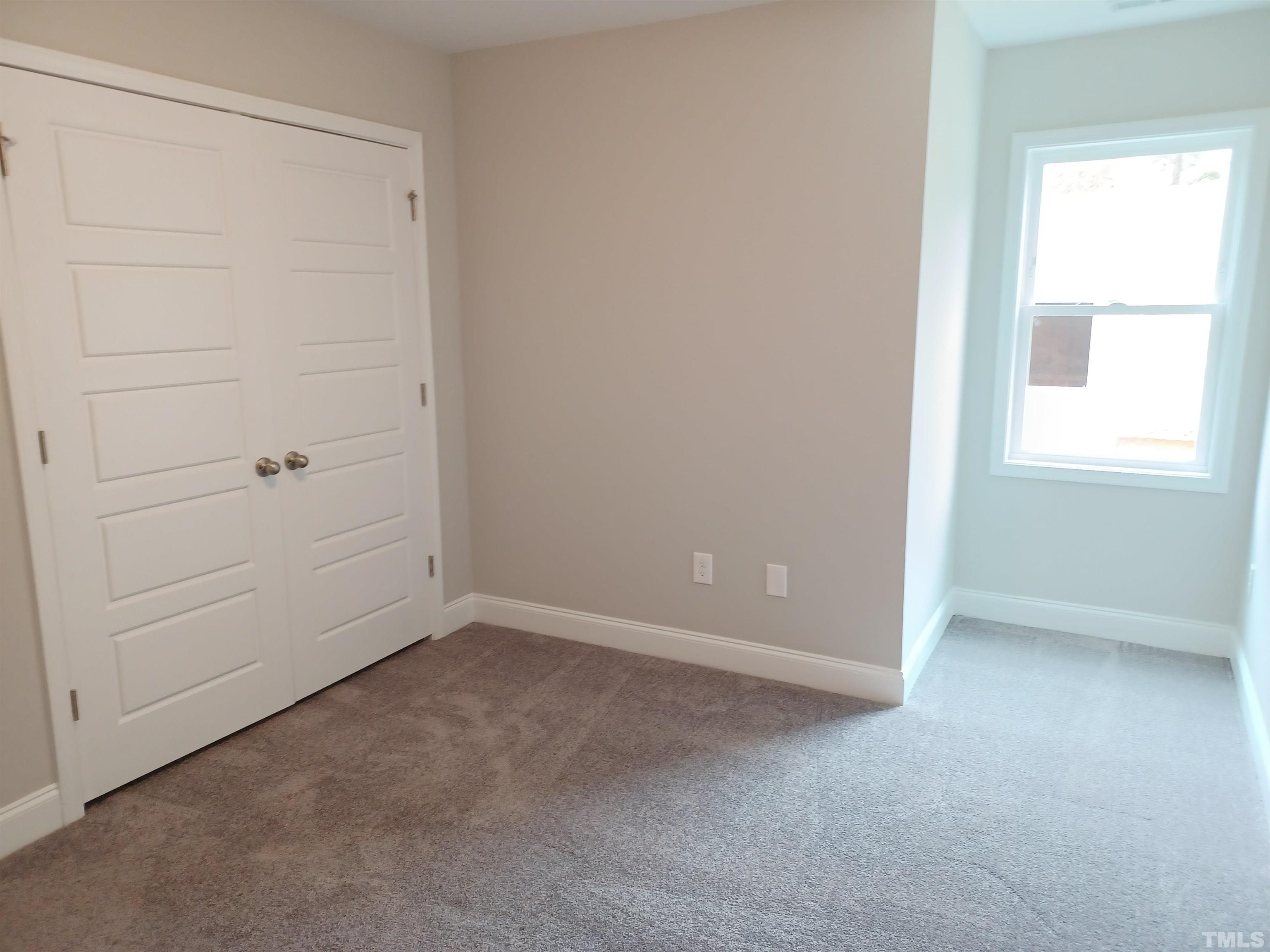 184 Howards Crossing Drive Wendell, NC 27591 - Photo 22 of 27 an empty room with windows