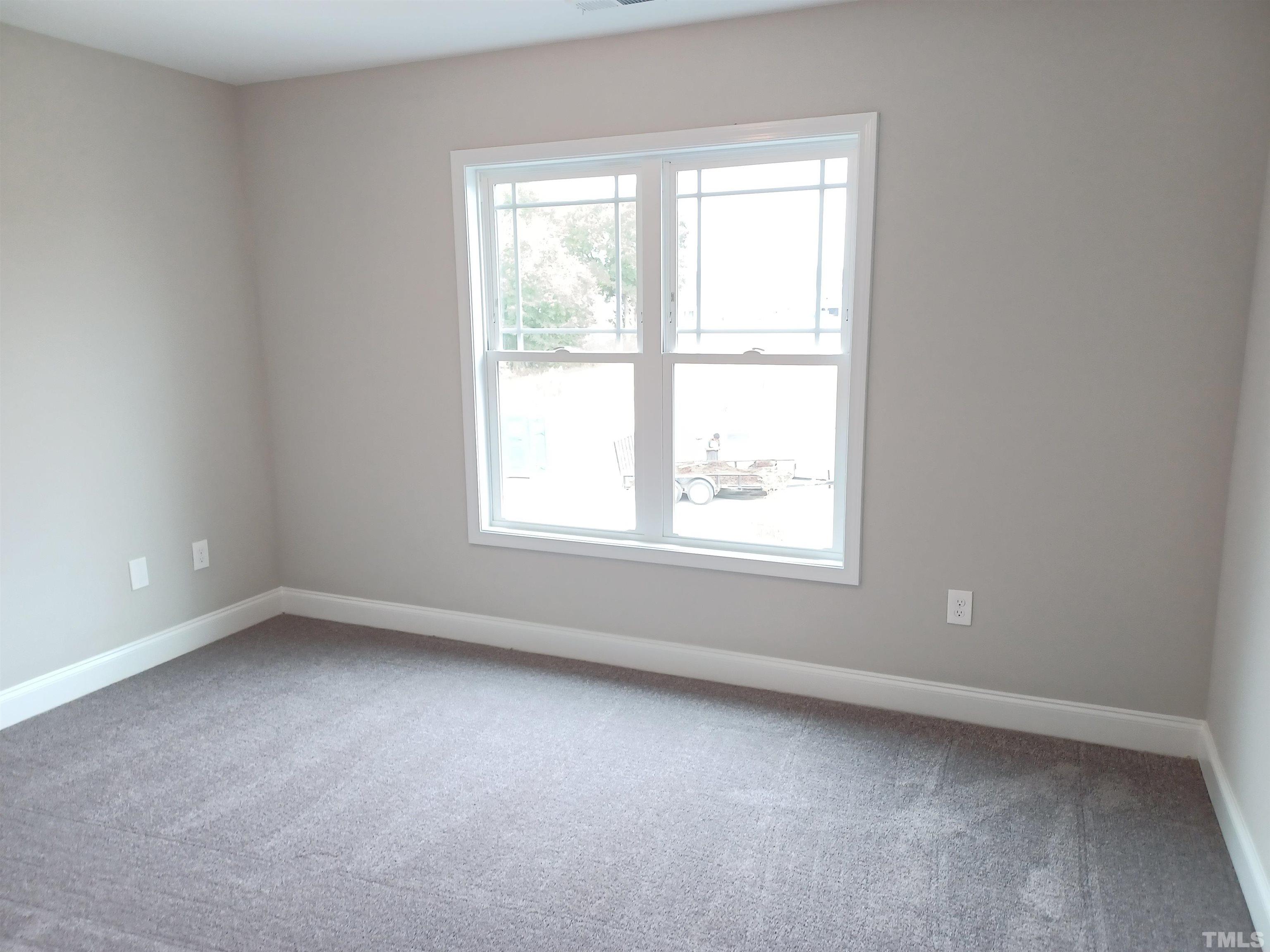 184 Howards Crossing Drive Wendell, NC 27591 - Photo 25 of 27 an empty room with a window