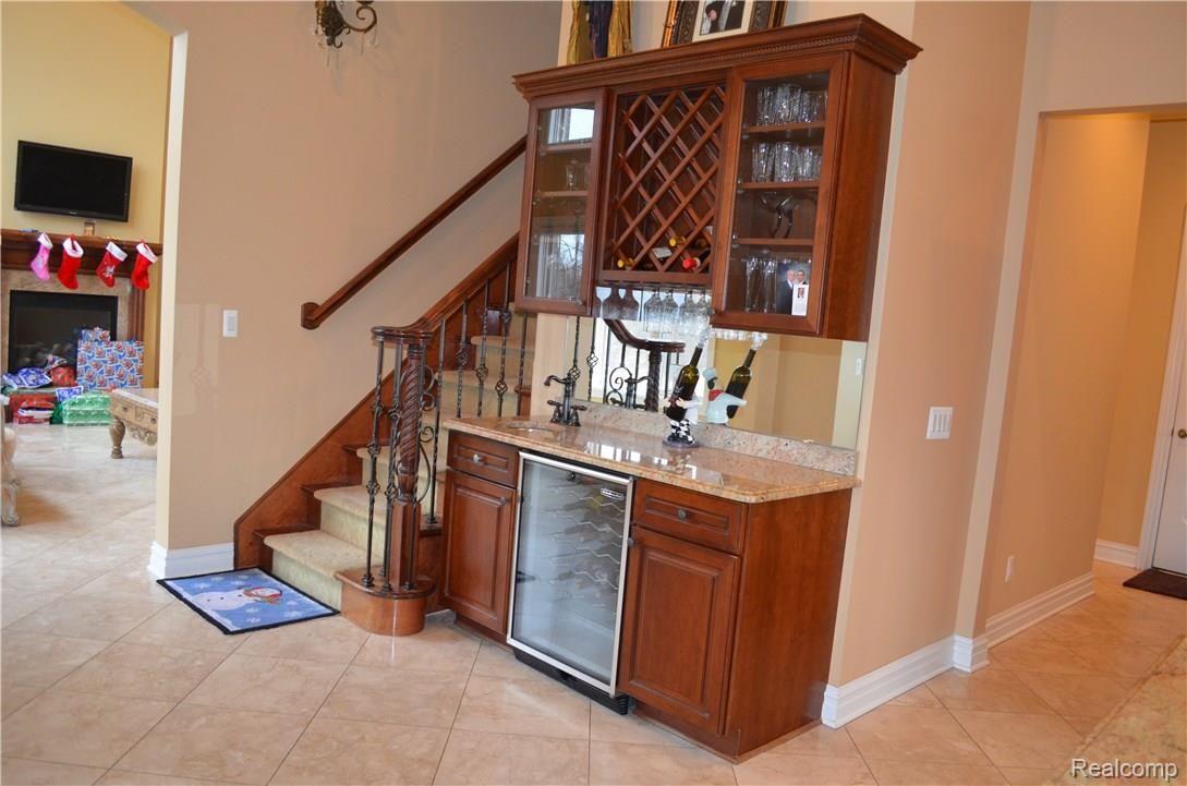 67808 Campground Road Washington, MI 48095 - Photo 18 of 77 KITCHEN WITH WET BAR AND WINE STORAGE