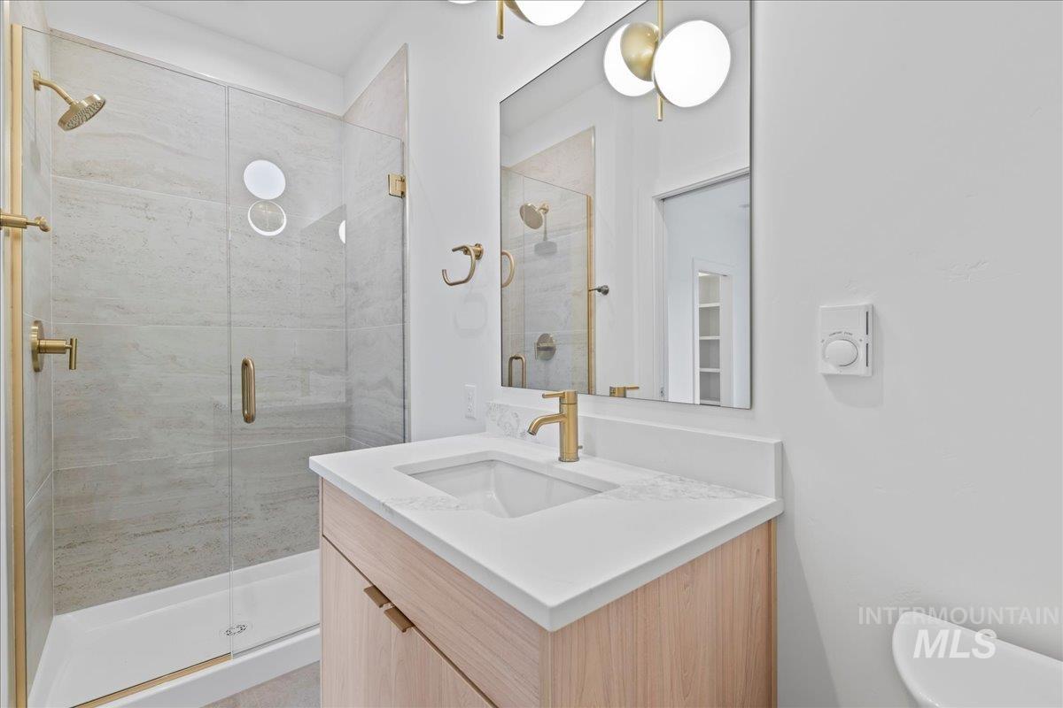 1011 South Orchard Street, Unit 105 Boise, ID 83705 - Photo 15 of 15 Full bathroom with vanity and a shower stall