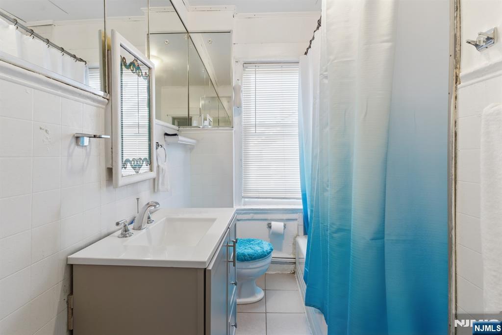 90 Renner Avenue Newark, NJ 07112 - Photo 14 of 25 a bathroom with a sink and a toilet