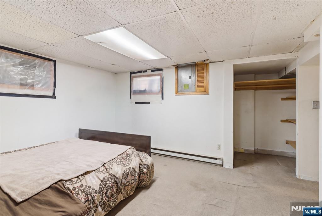 90 Renner Avenue Newark, NJ 07112 - Photo 20 of 25 a bedroom with a bed and a view of bedroom
