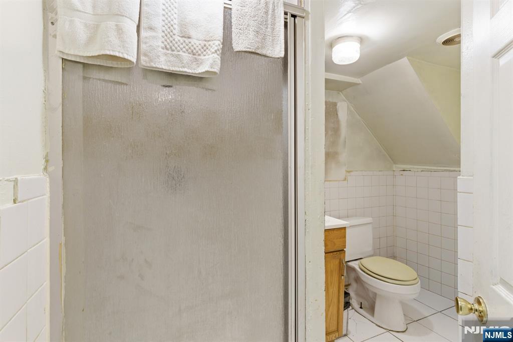 90 Renner Avenue Newark, NJ 07112 - Photo 21 of 25 a bathroom with a toilet and a shower