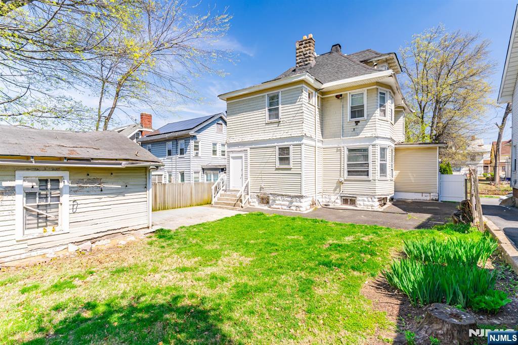 90 Renner Avenue Newark, NJ 07112 - Photo 25 of 25 a view of a house with a yard porch and sitting area