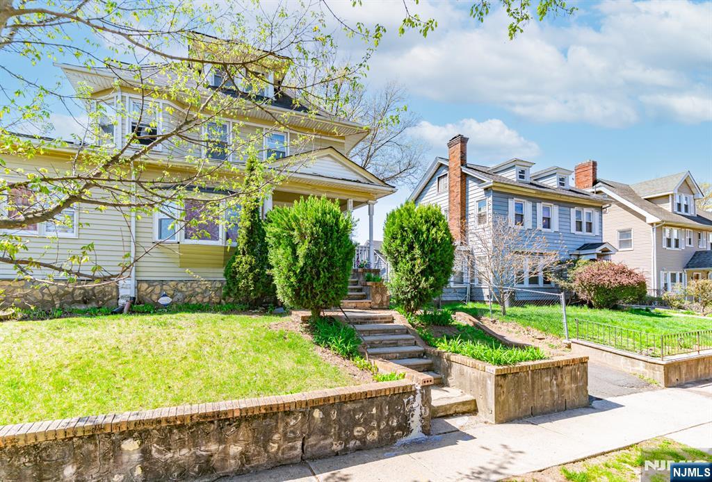90 Renner Avenue Newark, NJ 07112 - Photo 3 of 25 a front view of a house with swimming pool