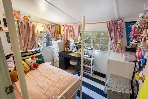 a bed room with a bed and a window