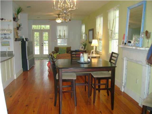 1594 Co Road North Santa Rosa Beach, FL 32459 - Photo 2 of 11 a view of a dining room with furniture and wooden floor