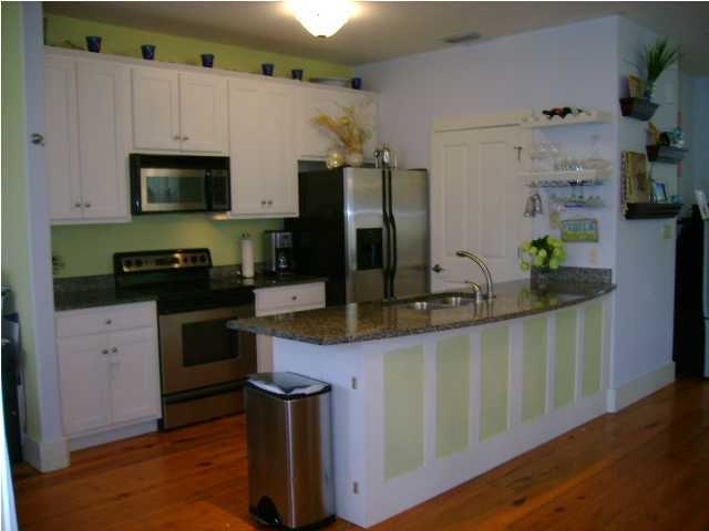 1594 Co Road North Santa Rosa Beach, FL 32459 - Photo 3 of 11 a kitchen with stainless steel appliances granite countertop a sink stove and refrigerator