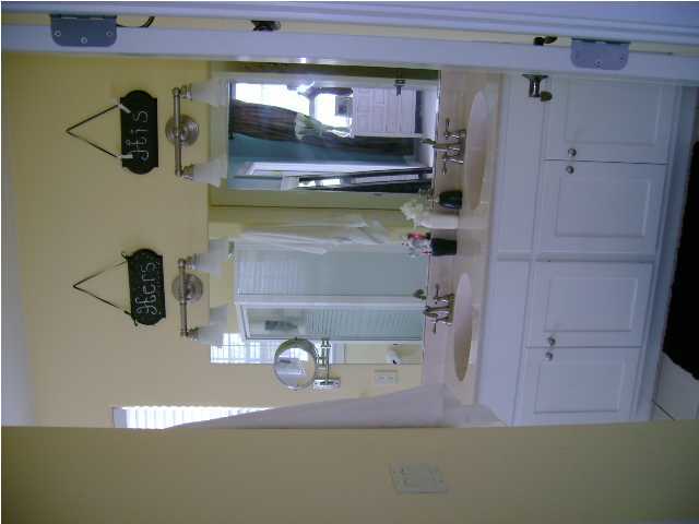 1594 Co Road North Santa Rosa Beach, FL 32459 - Photo 9 of 11 a bathroom with a sink and a mirror