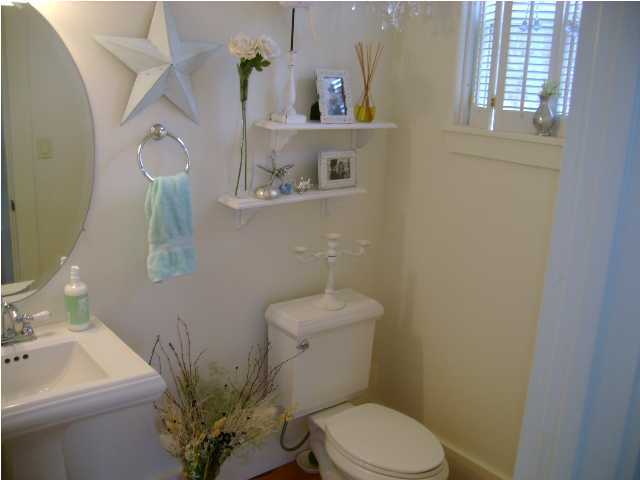 1594 Co Road North Santa Rosa Beach, FL 32459 - Photo 10 of 11 a bathroom with a toilet a sink and mirror
