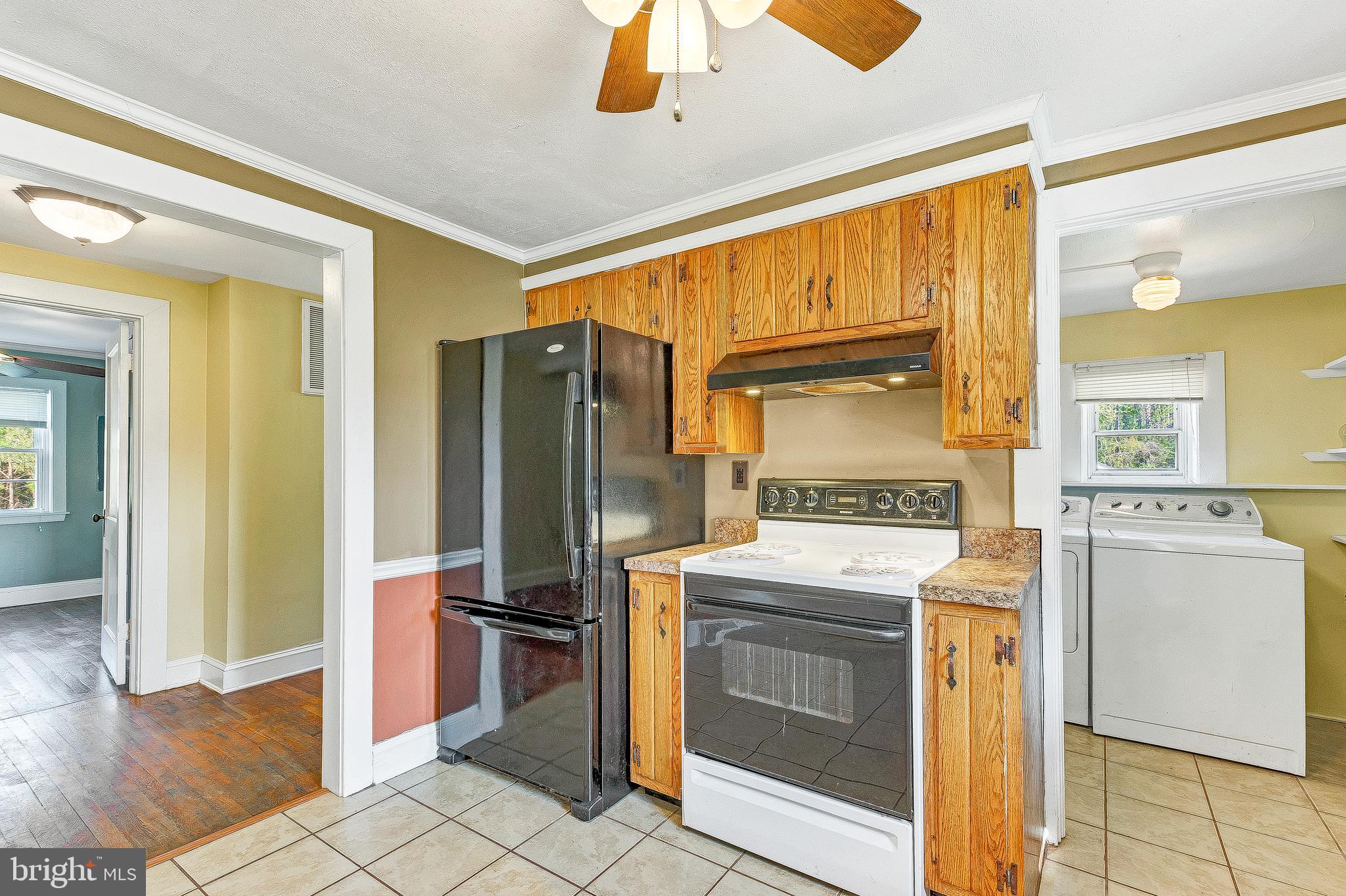 49264 Bennett Drive Ridge, MD 20680 - Photo 16 of 27 Laundry behind kitchen