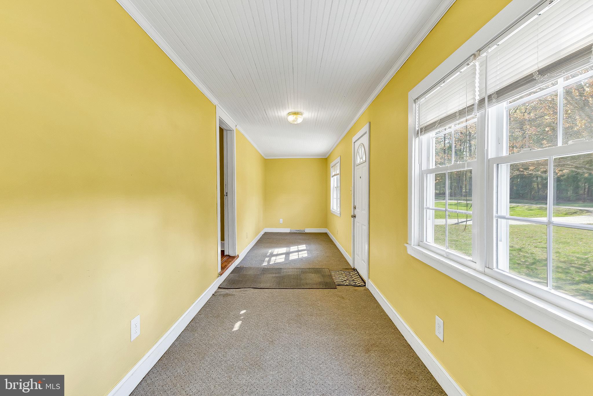 49264 Bennett Drive Ridge, MD 20680 - Photo 4 of 27 Enclosed porch area off of front entrance