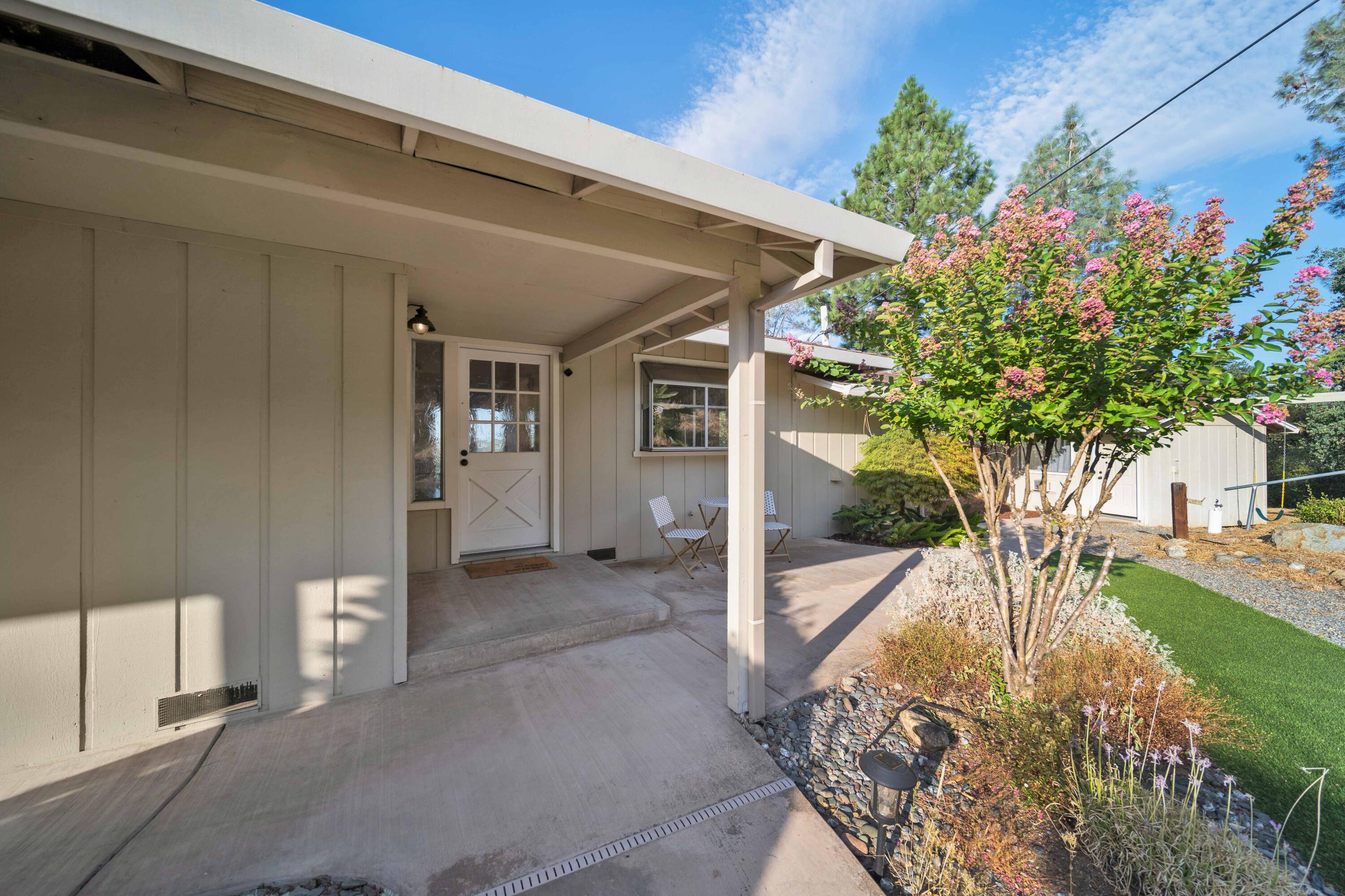 1705 Barbara Road Redding, CA 96003 - Photo 33 of 103 a view of a patio with table and chairs and potted plants